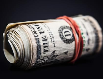 An image of a roll of money